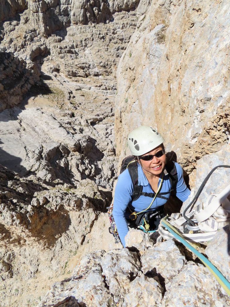 Shirley arriving on a nice ledge that is the top of pitch 2 (August 2020).